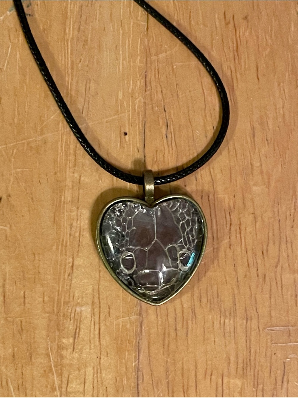 Heart shaped snake’s head pendant